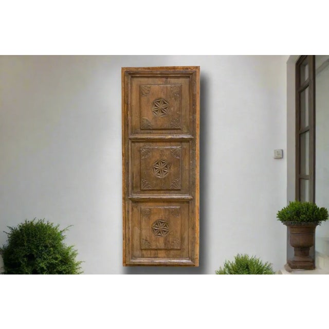 Spanish Basque carved 3-panel wood door, a captivating relic from the 18th century. This beautifully-rustic antique door...