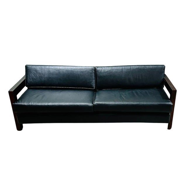 Brazilian rosewood sofa black leather, 1960. Completely restores and upholstered in black leather. This piece is composed...