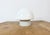 Vintage industrial ceiling or wall light made in former Czechoslivakia during the 1970s. It features a white porcelain...
