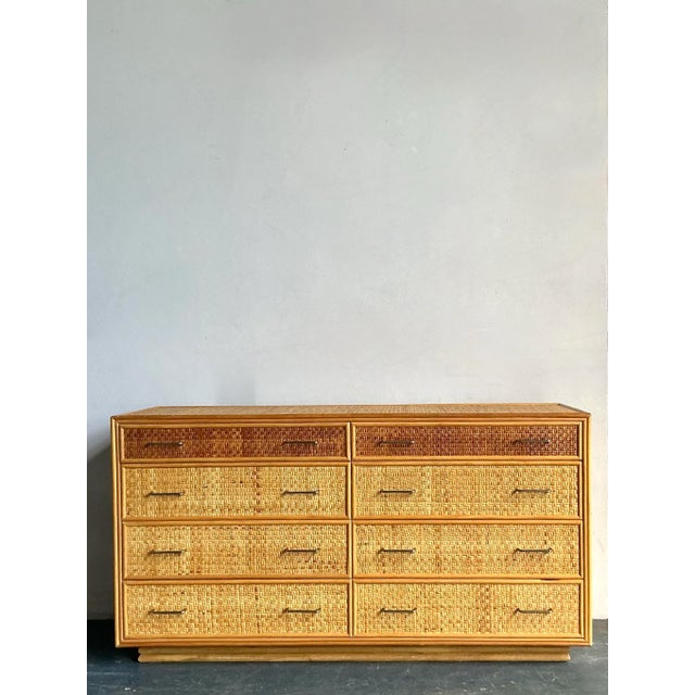 Embrace the relaxed sophistication of this vintage Boho woven rattan dresser, a stunning piece that seamlessly blends...
