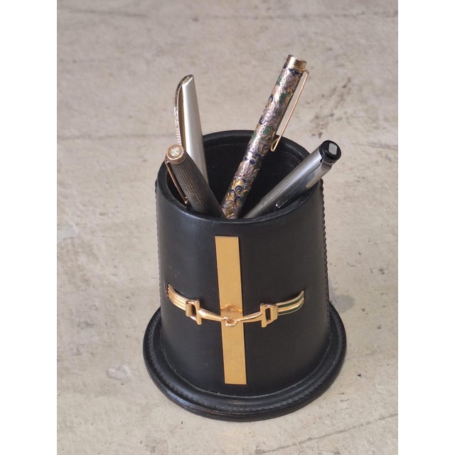 A rare and sophisticated vintage Gucci desk accessory crafted in Italy, featuring the house’s iconic horsebit hardware and...