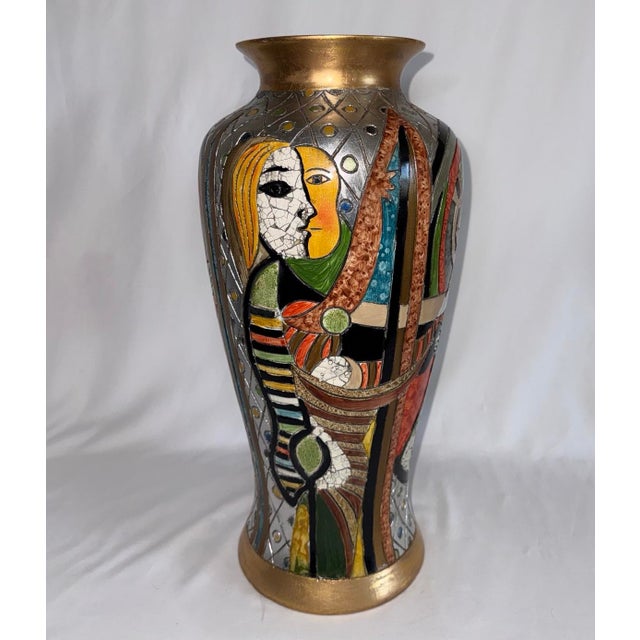 Large 18” tall Picasso inspired cubist faces vase. Multicolor with gilt banding at base and rim, and silver grid pattern...