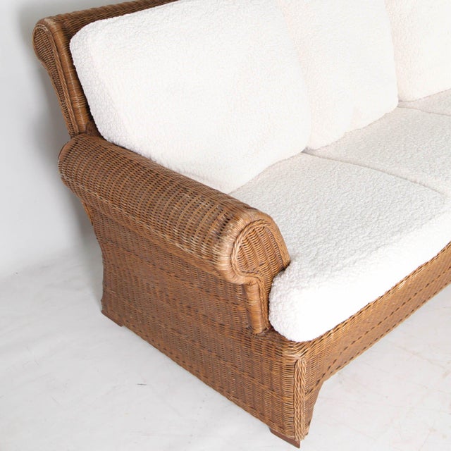 Stunning wicker lounge set comprising a sofa and two large armchairs. Made in the 1970s from finely woven wicker. A very...