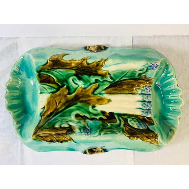 This Antique French Art Nouveau Asparagus Dish Platter Server by Majolica is a stunning piece of 19th-century pottery....