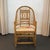 This Brighton Pavilion-style armchair circa the 1970s features an architectural tortoise bamboo and rattan frame detailed...