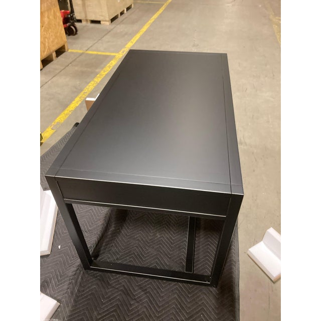 Solid natural wood desk featuring a black finish, solid iron hardware, and two drawers on either side of desk. Dimensions:...