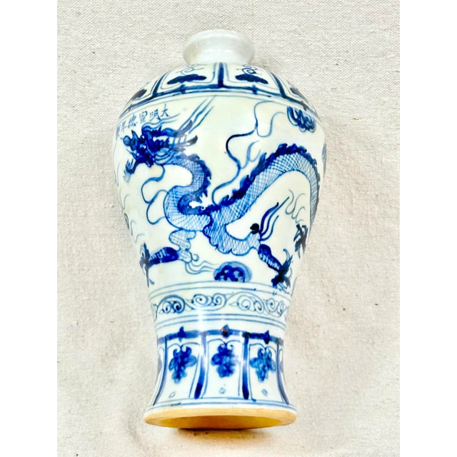 Gorgeous antique Chinese vase. Matte glaze with blue and white scene. Beautiful piece that will bring a pop of color into...