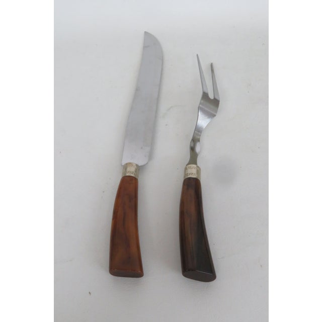 This lovely Roast Carving 2pc Set features a stainless steel blade with a bakelite handle. This beautiful serving utensil...