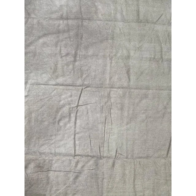 Nice flat rug with a khaki field color, entirely hand woven with cotton on cotton foundation.