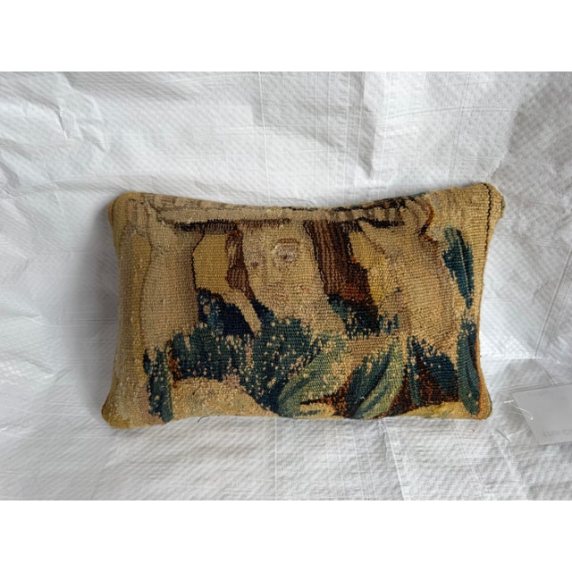 This museum-quality pillow preserves an original section of a rare 17th Century Brussels tapestry, showcasing the...