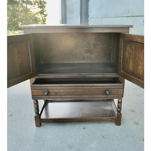Gothic Oak Cupboard with Drawer and Under-tier A Charming piece dating from the 1930s, the cabinet has a 2 door cupboard...