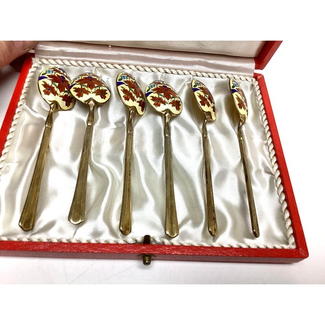 Set of 6 Enamel and Sterling Silver English Demitasse Spoons in Fitted Box. Each spoon measures 4 inches long and the bowl...