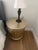 Striking pair of Neoclassical-style gold fluted drum nightstands featuring removable tops and exceptionally generous...