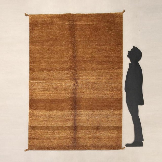 Gabbeh rug in wool, large knot and hand-made. This piece is attributed to the mentioned designer/maker. It has no...