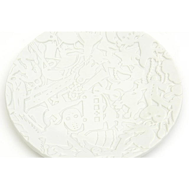 This amazing limited edition porcelain textural relief plate is a piece of art and sculpture with surround coded messages...