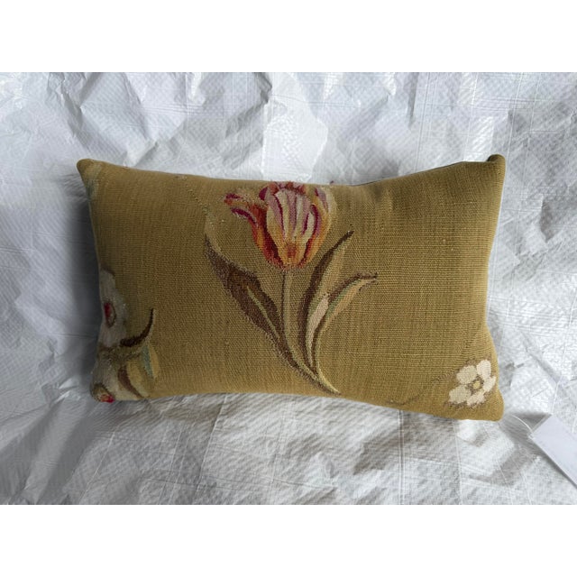 This museum-quality Aubusson tapestry pillow preserves a genuine fragment from one of France's most celebrated weaving...
