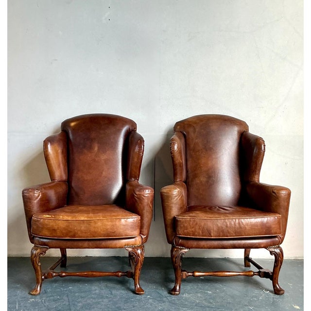 This pair of vintage Italian wingback chairs exemplifies timeless European craftsmanship, blending refined traditional...
