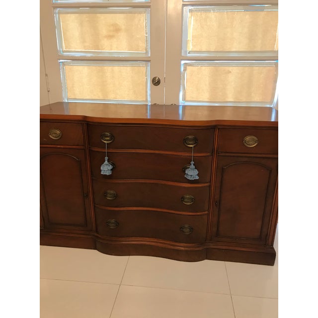 Elegant vintage mahogany dresser / chest of drawers featuring a distinctive 12-drawer configuration, gracefully curved...