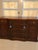 Elegant vintage mahogany dresser / chest of drawers featuring a distinctive 12-drawer configuration, gracefully curved...