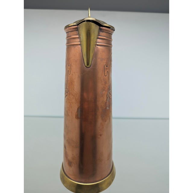 Classic Art Nouveau wine or cocoa jug made of copper and brass, tinned inside. Made in Germany, circa 1900. Height: 28 cm...
