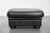 Large and timeless black ottoman made of English-style cowhide. : A cowhide footstool, also called a footstool, transforms...