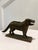 A wonderful antique American cast iron figural dog nutcracker dating to the early 20th century, featuring a beautifully...