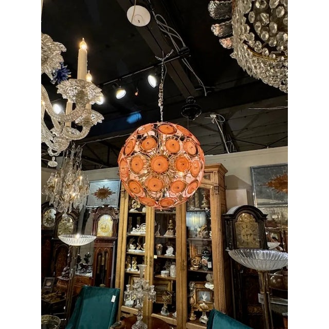 Fabulous modern Murano glass pale orange disc sputnik chandelier. The chandelier has been professionally rewired, comes...
