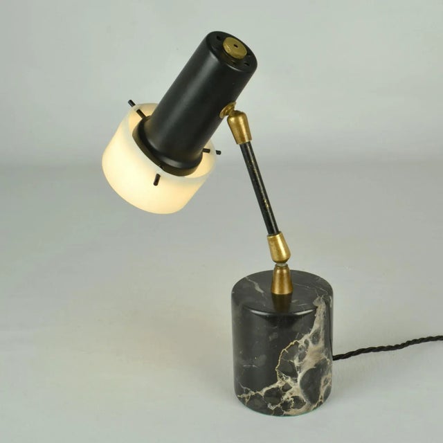 Rare small table lamp, manufactured by Stilux Milano, 1950's Italy. The shade of the lamp is in black metal with perspex...