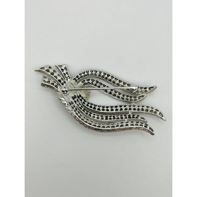 Crown Trifari, 1963 Cavalcade Collection brooch, dark blue rhinestone, silver tone, signed, 3”