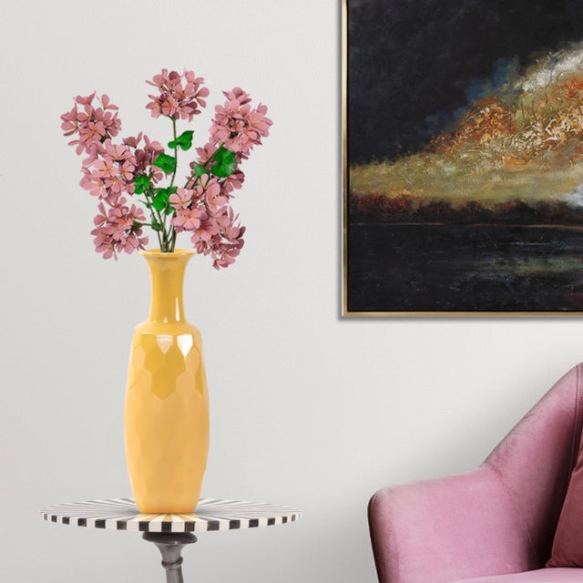 A stunning piece from our collection featuring a honeycomb-designed texture. With its rich golden yellow color, this vase...