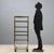 Display stand with wheels and 7 clear glass shelves, with brass-plated metal and brass structure. This piece is attributed...
