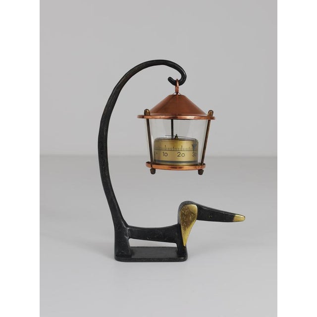 A charming Austrian Mid-Century desk thermometer, consisting of a nice wiener dog / sausage dog figurine made of brass and...