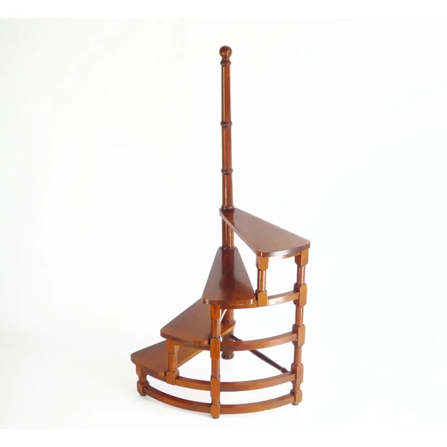 Vintage wooden library stairs with 4 steps in total and a central wooden carved pole which is screwed. The steps have a...