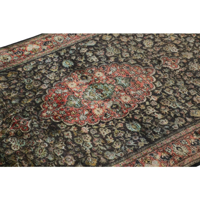 Hand-knotted in a luxurious all-silk construction circa 1920-1930, this 3x5 antique Persian Qum rug is a rare new addition...