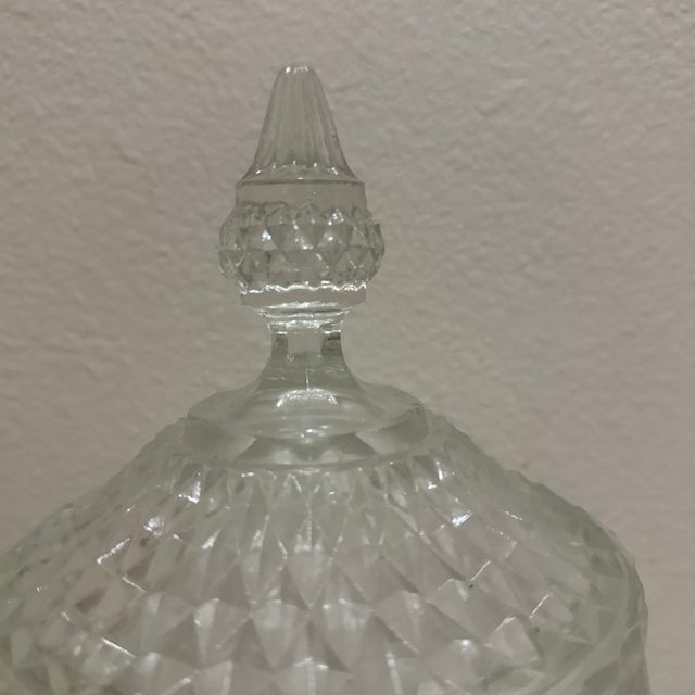 A beautiful example of classic American pressed glass, this vintage Indiana Glass Diamond Point footed candy dish features...
