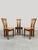 This set of vintage dining chairs is crafted from solid wood and shows influences from the work of Pierre Chapo from...