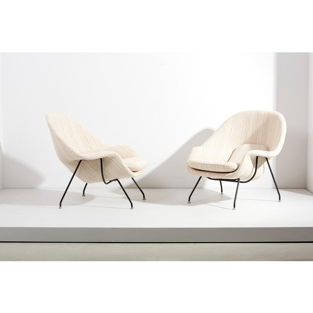 Set of two Early Eero Saarinen womb chairs and ottoman for Knoll, USA from the 1960s. Newly upholstered in a Knoll fabric....