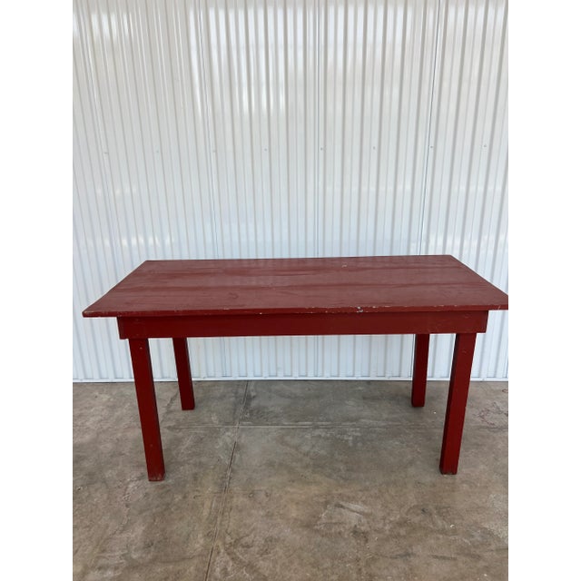 A very old farmhouse style work table. Could be used for an entry, a kitchen island, a laundry table or a petite dining...