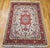 "This finely woven Persian Tabriz area rug from the late 1900s showcases the timeless elegance of the classic floral...