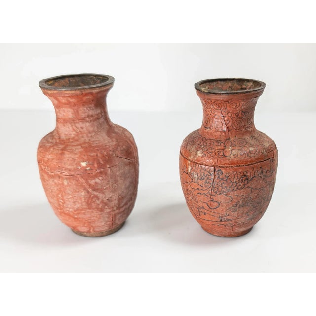 We are selling this pair of Chinese Cinnabar lacquer vases. These vases have great distressed worn surface with cracking...