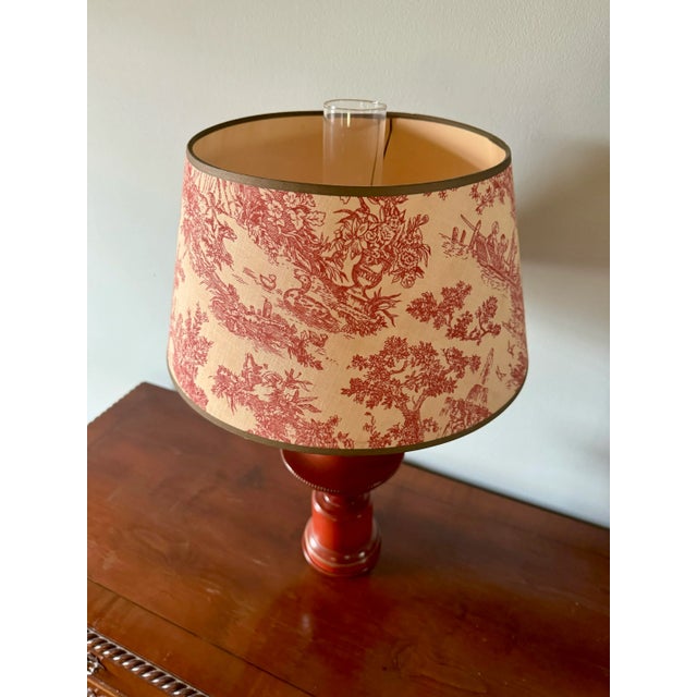 Lovely mid 20th century tole lamp with glass hurricane and toile shade. Original wiring has been tested and works with no...