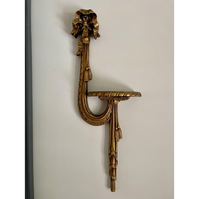 This pair of Vintage 1960s Giltwood Display Shelves celebrate the luxe of Old World Charm. The gold leaf adds elegance to...