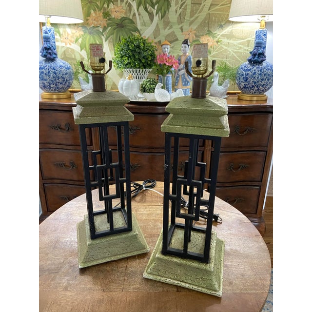 Absolutely fabulous pair of mid century, deco-style iron cage lamps in lovely condition. Heavy wrought iron frame nestled...
