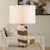 This Chic Art Glass Table Lamp Features A Dynamic Swirl Of White And Brown Tones, Accented With Antique Brass Plated...
