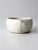 This vintage handmade studio pottery berry bowl features a softly rounded form with a creamy white speckled glaze and...
