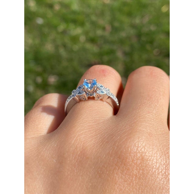 The Sarlat: Aquamarine Engagement Ring with Natural Diamonds in Platinum. This stunning ring features a round brilliant...