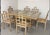 A very beautiful and rare dining room set. Six cane chairs and a large wood and glass table. High-quality production from...