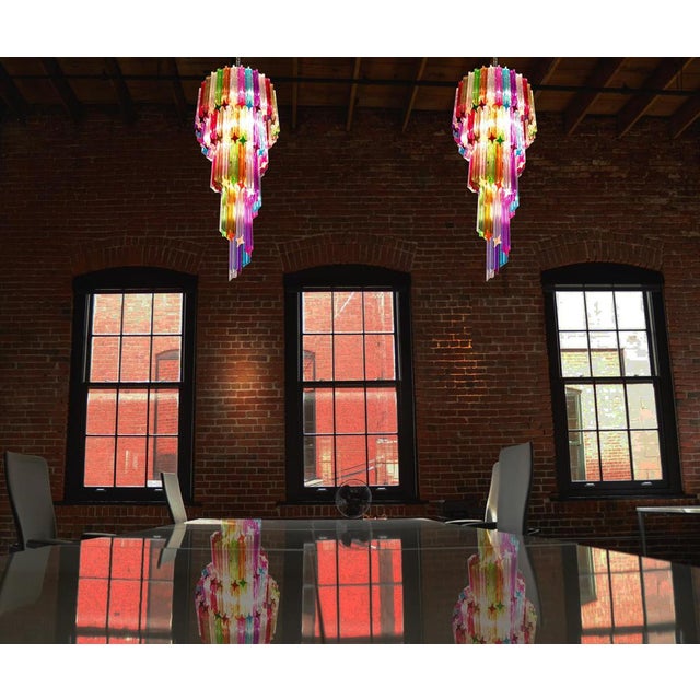 Fantastic Pair Murano chandeliers each made by 86 Murano crystal multicolored prism in a nickel metal frame. The shape of...