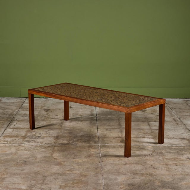 Rectangular coffee table by Gordon & Jane Martz. The table top is inlaid with green ceramic coin tiles. The frame, base...