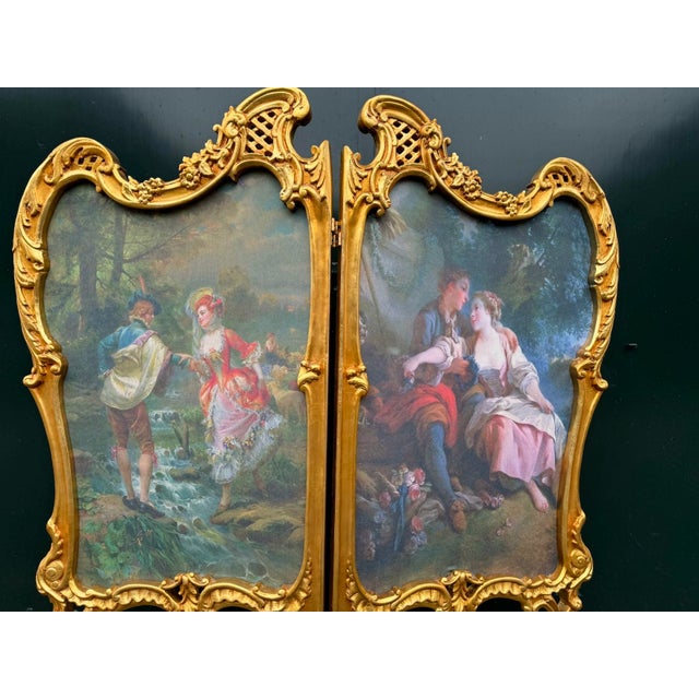 A romantic 1960 French Louis XVI style two-panel room divider screen, handmade from carved beechwood with an antique gold...